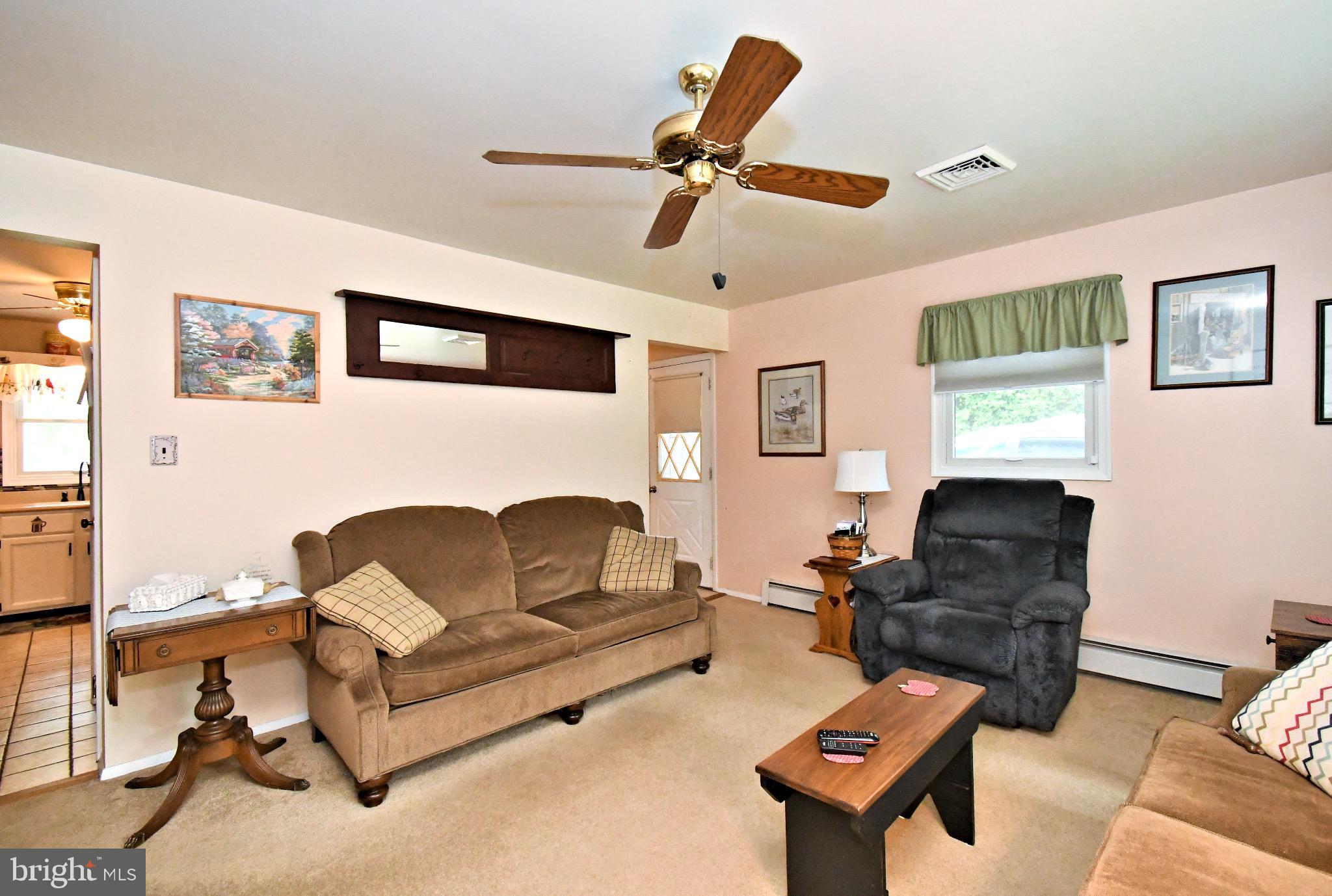 336 Arch Street Spring City, PA 19475 - Photo 6 of 58 a living room with furniture a ceiling fan and a window