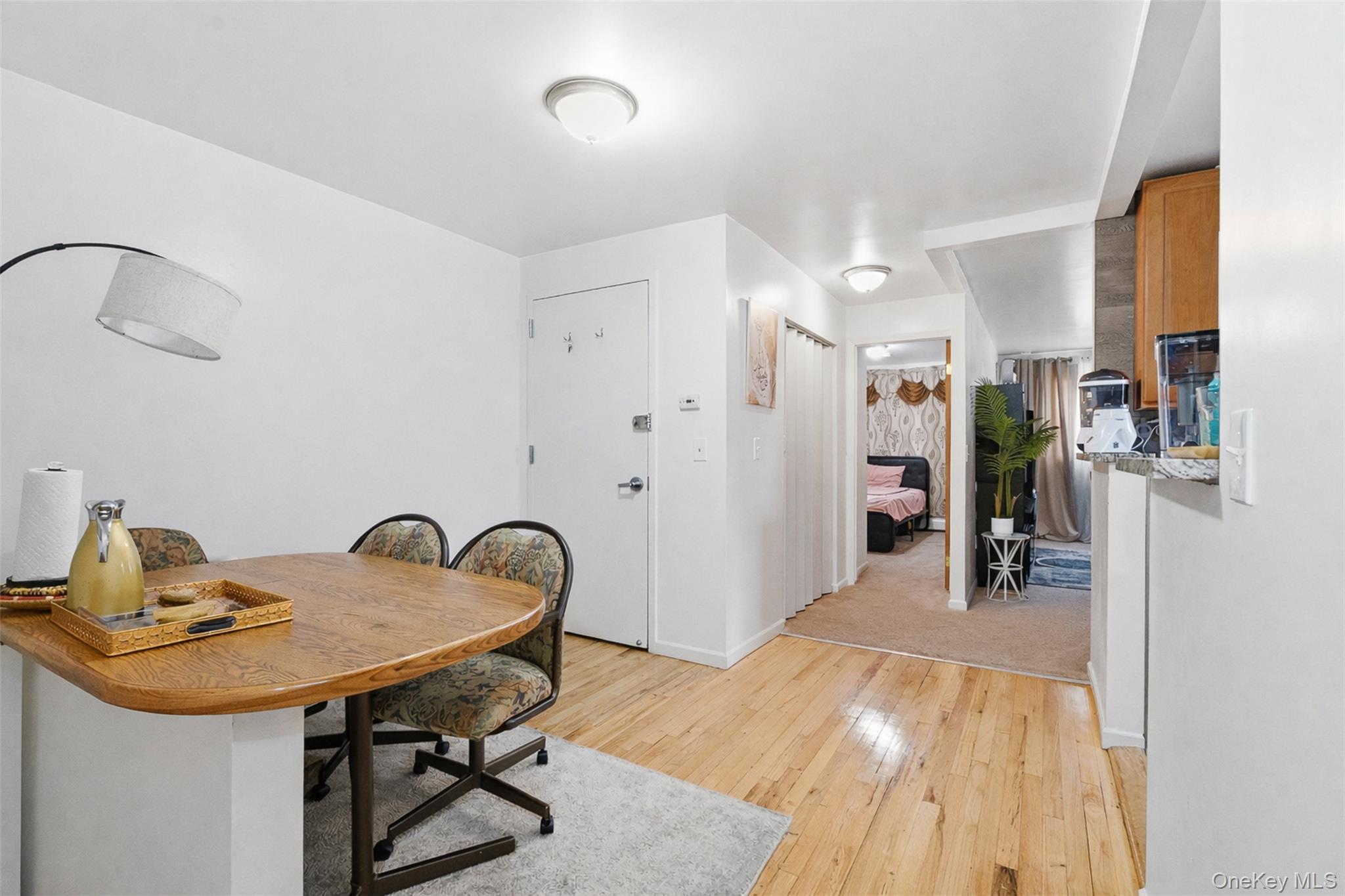 1677 Unionport Road Bronx, NY 10460 - Photo 13 of 33 Dining room with light wood-type flooring and baseboards