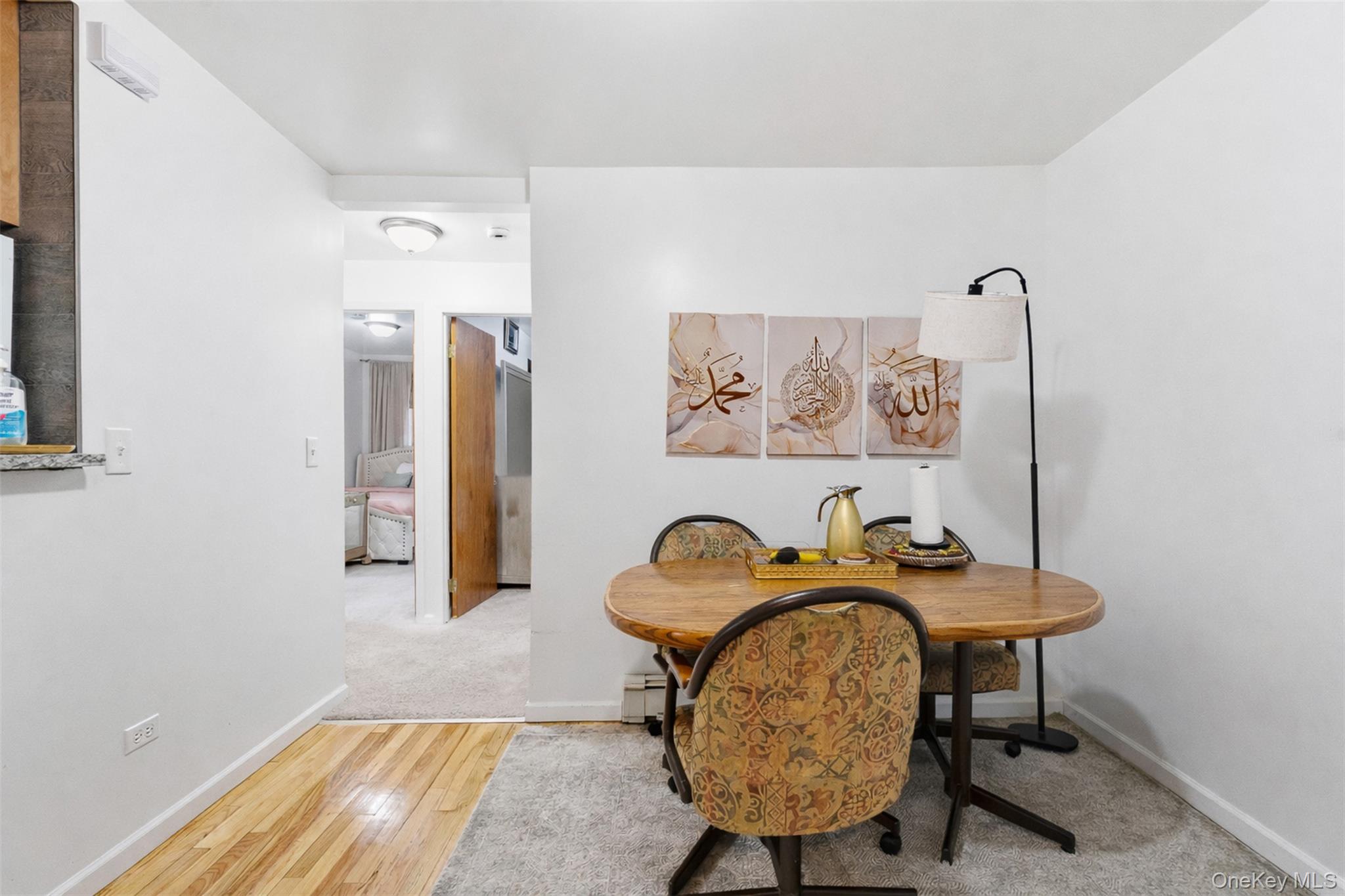 1677 Unionport Road Bronx, NY 10460 - Photo 14 of 33 Dining space featuring baseboards and light wood-type flooring