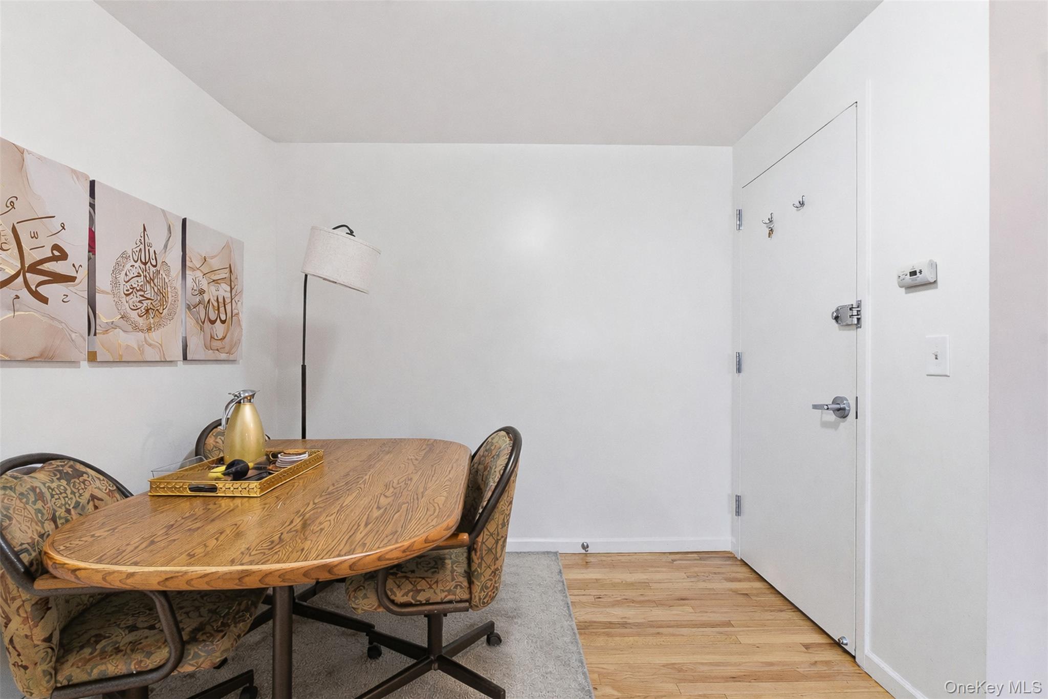 1677 Unionport Road Bronx, NY 10460 - Photo 15 of 33 Dining area featuring light wood finished floors and baseboards