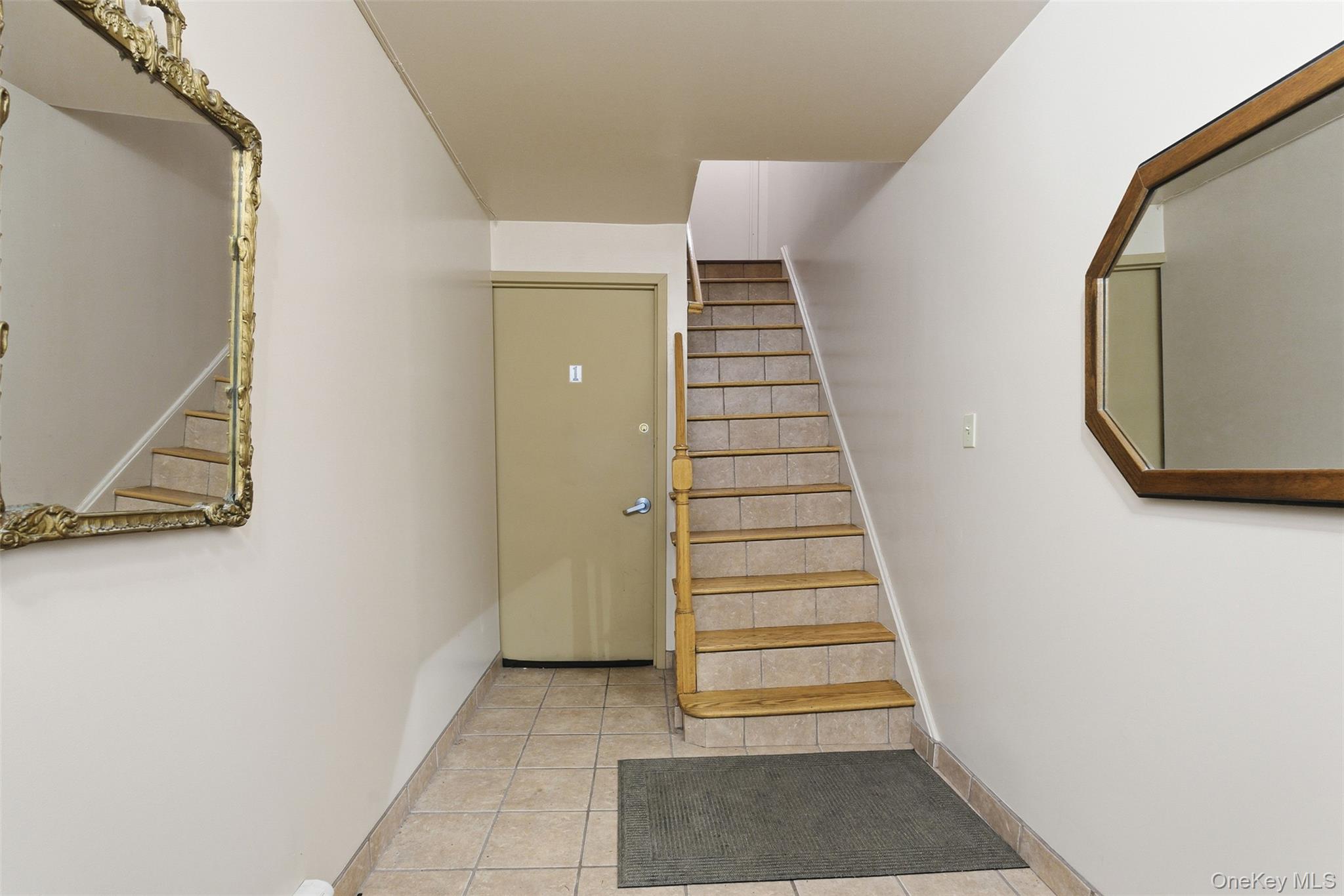 1677 Unionport Road Bronx, NY 10460 - Photo 2 of 33 Stairway with tile patterned floors to unit 1 and upstairs to unit 2