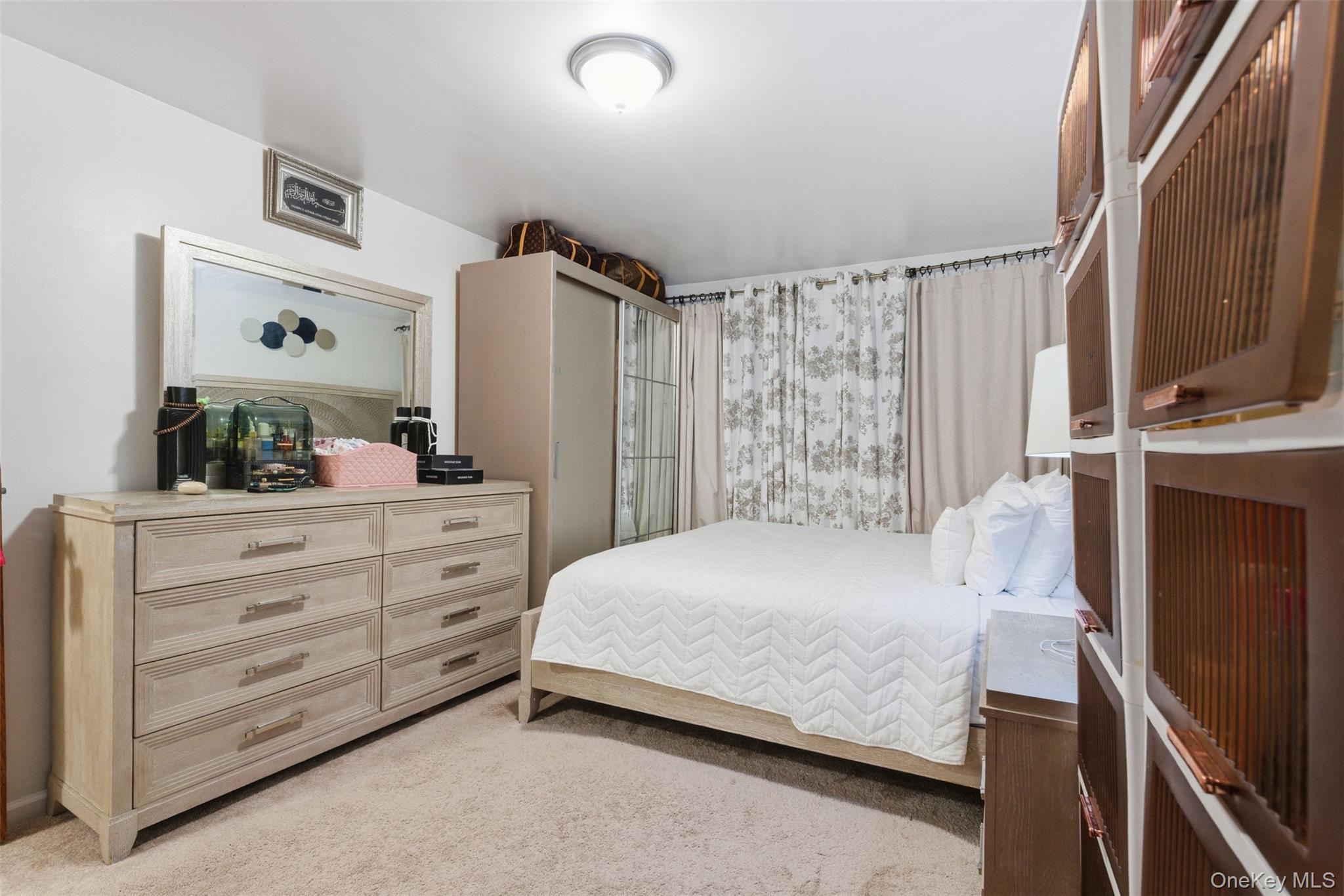 1677 Unionport Road Bronx, NY 10460 - Photo 21 of 33 Bedroom with light colored carpet