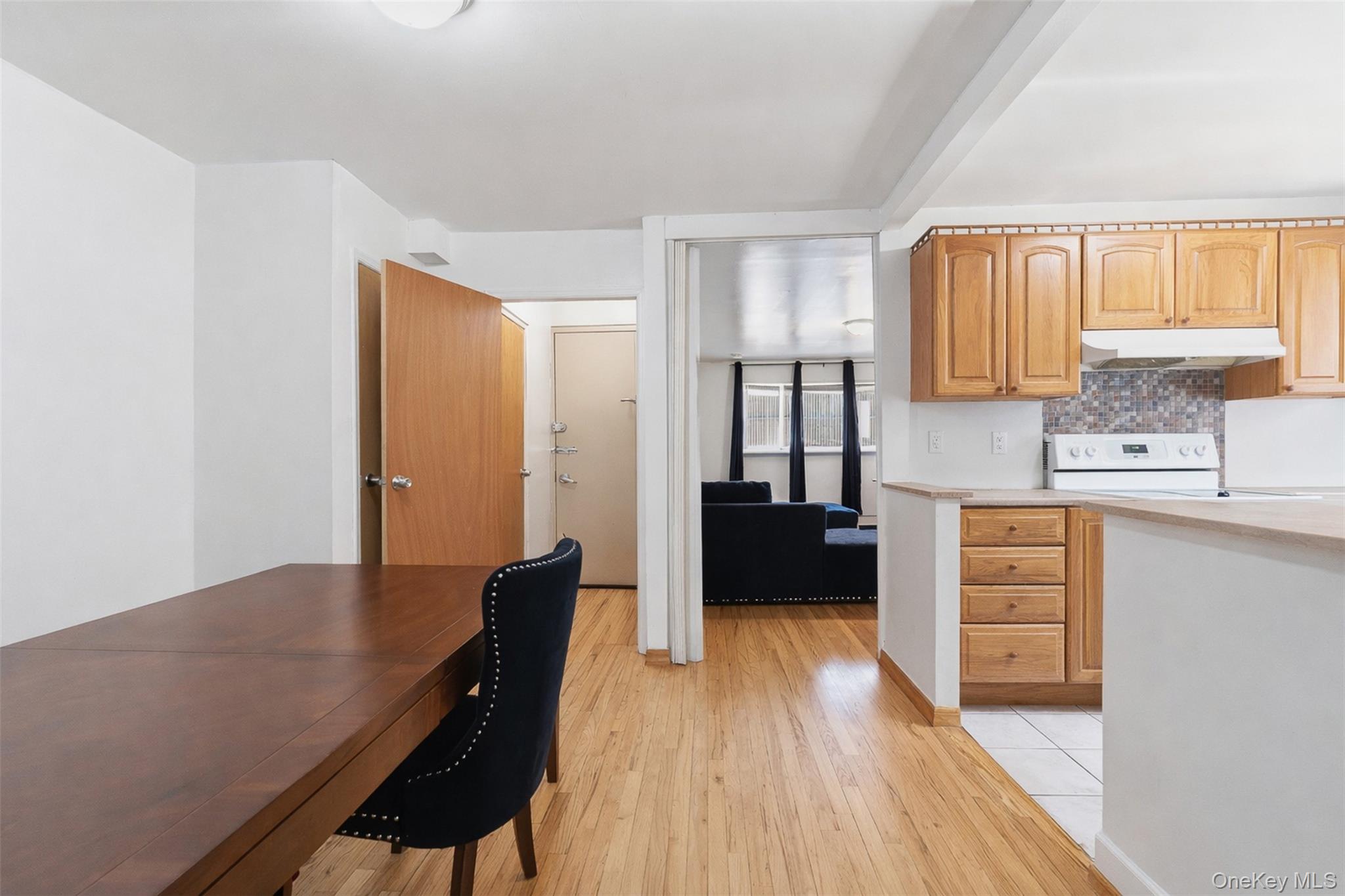 1677 Unionport Road Bronx, NY 10460 - Photo 3 of 33 Dining space with light wood-style flooring