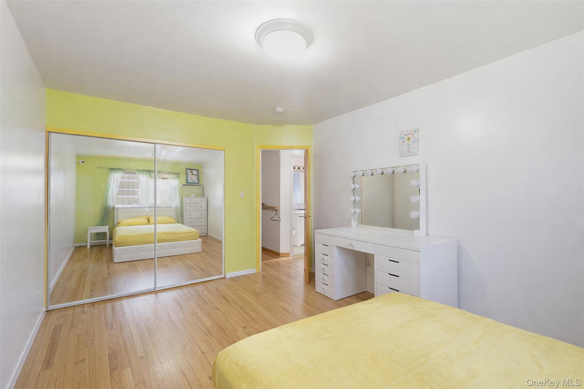 1677 Unionport Road Bronx, NY 10460 - Photo 8 of 33 Bedroom with light wood finished floors and a closet