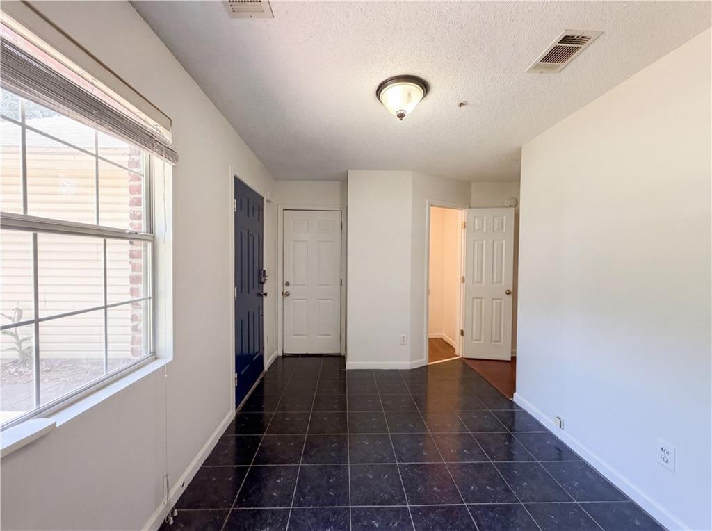 3753 Soapstone Road Decatur, GA 30034 - Photo 11 of 26 a view of an empty room and window