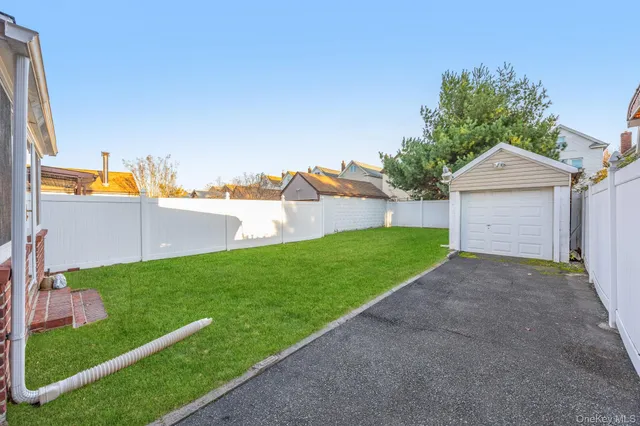 a view of a backyard with a garden and plants