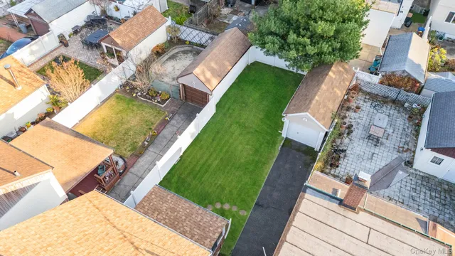 an aerial view of a house with a garden and swimming pool