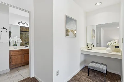 a en suite bathroom with a sink and a mirror