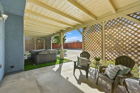 a patio with table and chairs