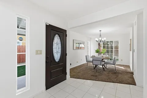 a view of a livingroom with furniture and a window
