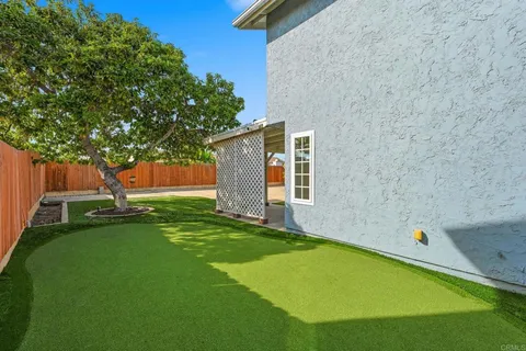 a view of a backyard with a small cabin
