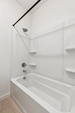 a bathroom with a bathtub and a sink