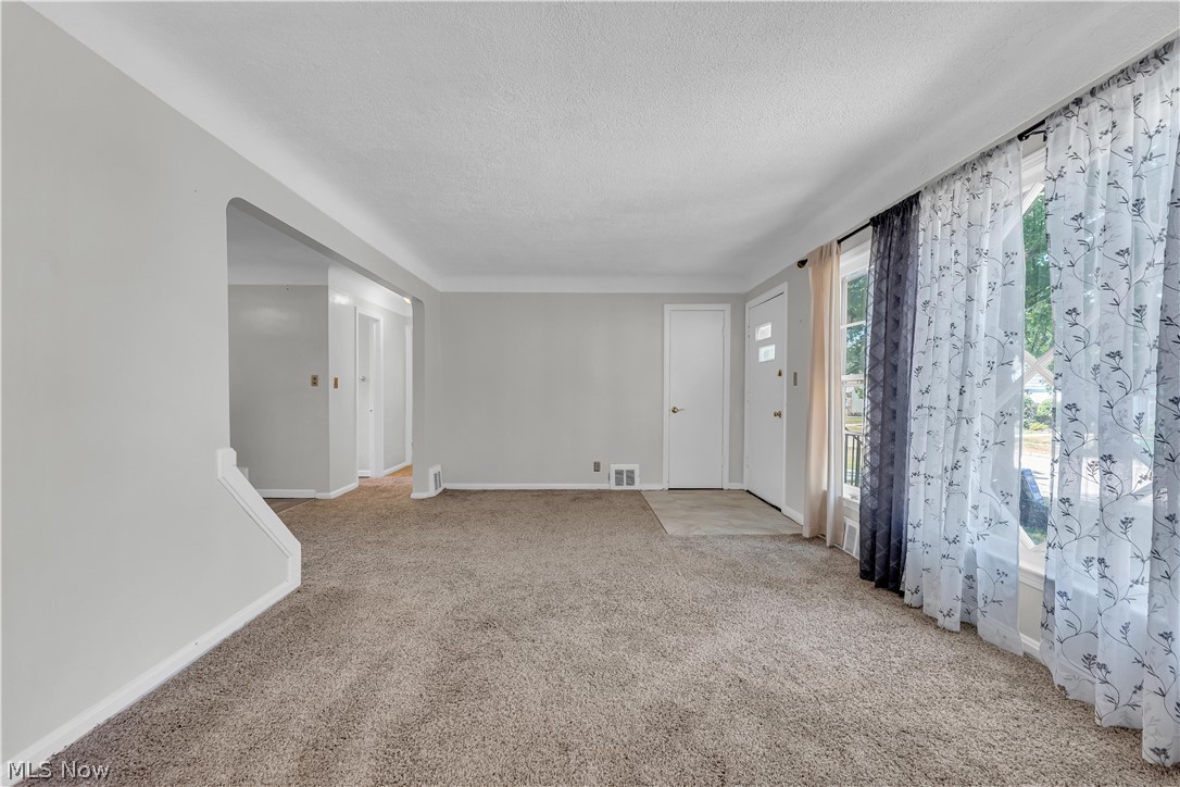 3842 Wallingford Road South Euclid, OH 44121 - Photo 7 of 31 Carpeted empty room with a textured ceiling