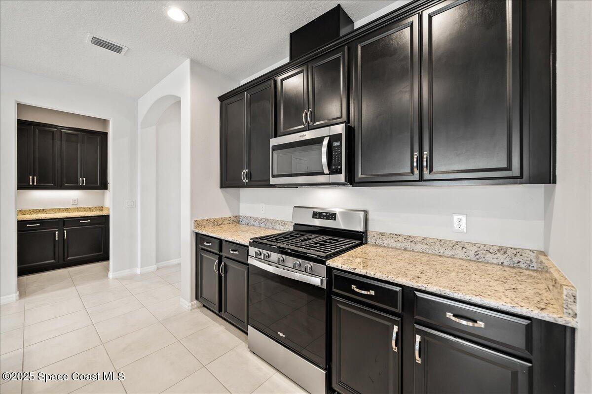3245 Hummingbird Way Melbourne, FL 32940 - Photo 18 of 66 Rich espresso cabinetry