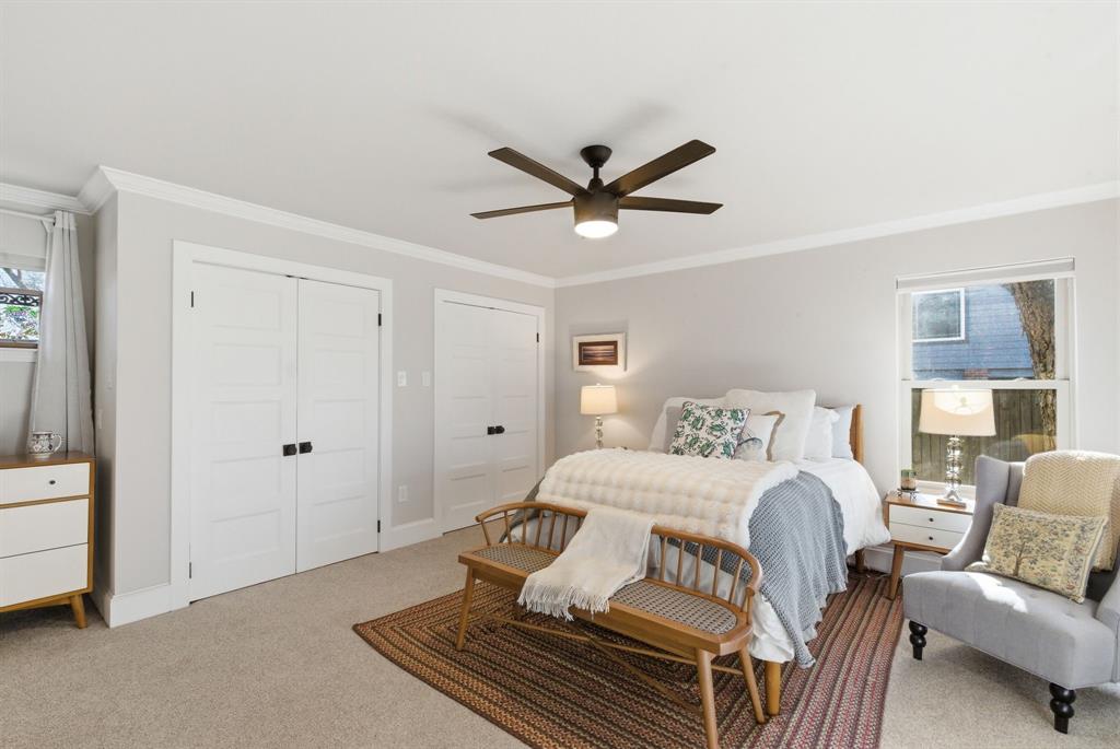 5206 Wedgefield Road Granbury, TX 76049 - Photo 15 of 39 a bedroom with a large bed couch and a window
