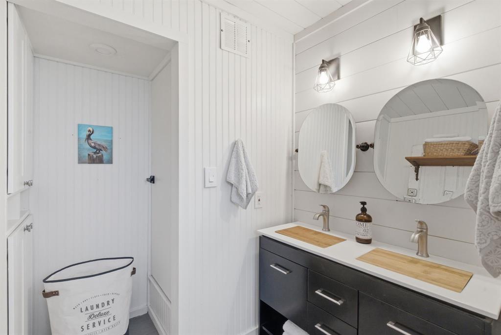 5206 Wedgefield Road Granbury, TX 76049 - Photo 19 of 39 a bathroom with a double vanity sink mirror and toilet