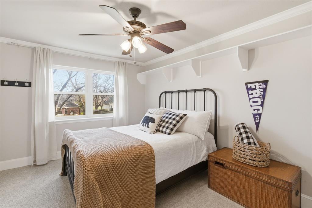 5206 Wedgefield Road Granbury, TX 76049 - Photo 21 of 39 a bedroom with a bed and a window