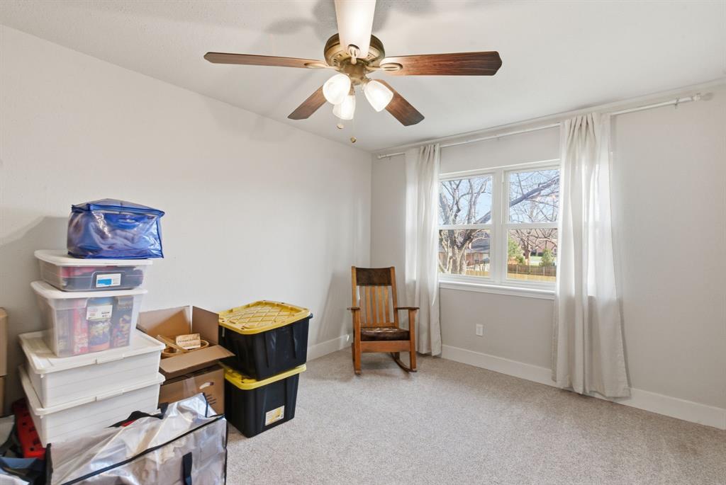 5206 Wedgefield Road Granbury, TX 76049 - Photo 23 of 39 a bedroom with furniture and a window