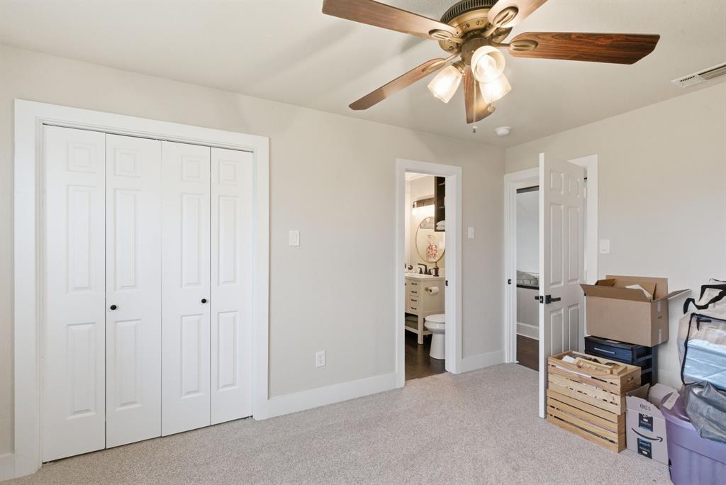 5206 Wedgefield Road Granbury, TX 76049 - Photo 24 of 39 wooden floor and chandelier fan in a room
