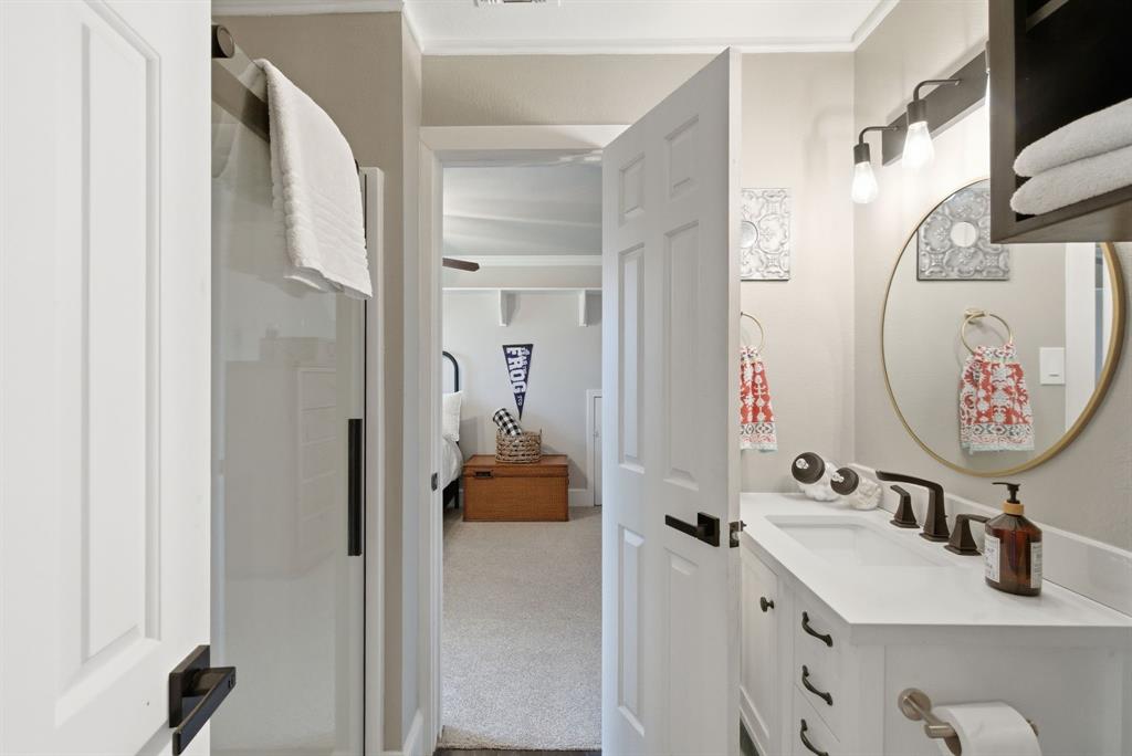 5206 Wedgefield Road Granbury, TX 76049 - Photo 25 of 39 a bathroom with a sink and a mirror
