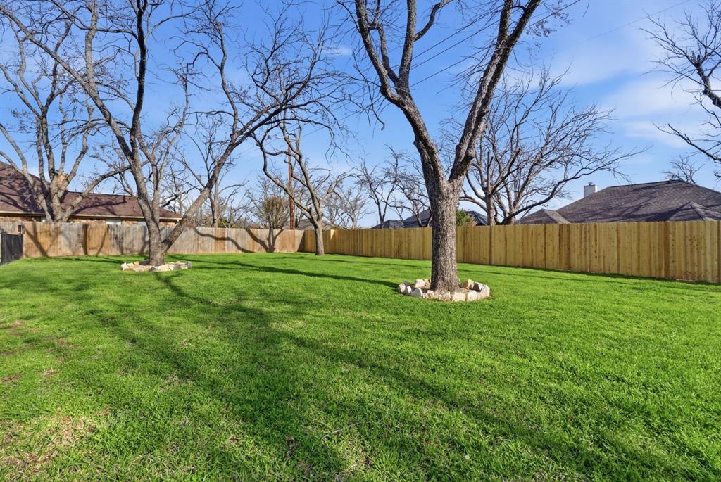 5206 Wedgefield Road Granbury, TX 76049 - Photo 30 of 39 a backyard of a house with lots of green space