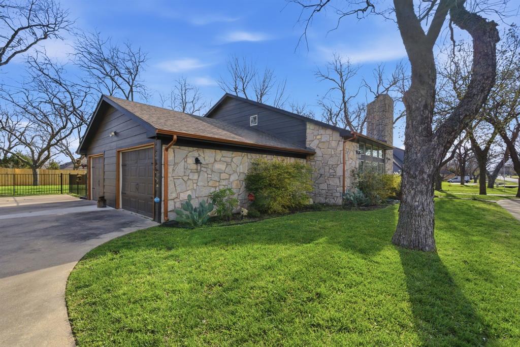5206 Wedgefield Road Granbury, TX 76049 - Photo 34 of 39 a view of a wooden house with a big yard and large tree