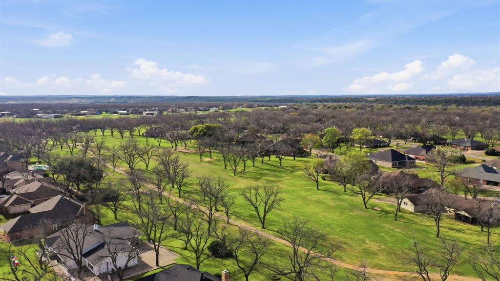 5206 Wedgefield Road Granbury, TX 76049 - Photo 35 of 39 a view of a lake with houses in back