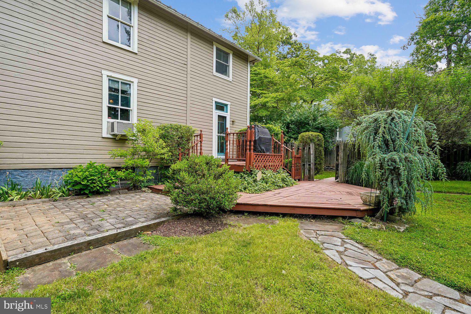 16 Maple Avenue Washington Grove, MD 20880 - Photo 4 of 58 Charming backyard retreat with lush greenery.