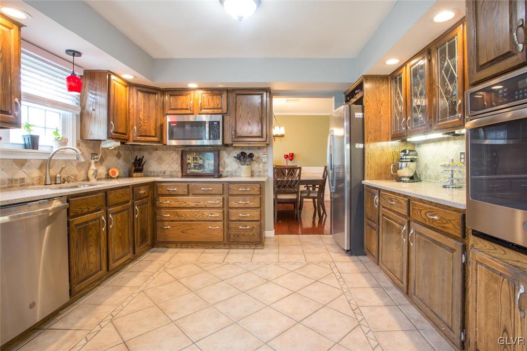 141 West Aluta Mill Road Nazareth, PA 18064 - Photo 6 of 32 a kitchen with stainless steel appliances kitchen island granite countertop a sink and cabinets