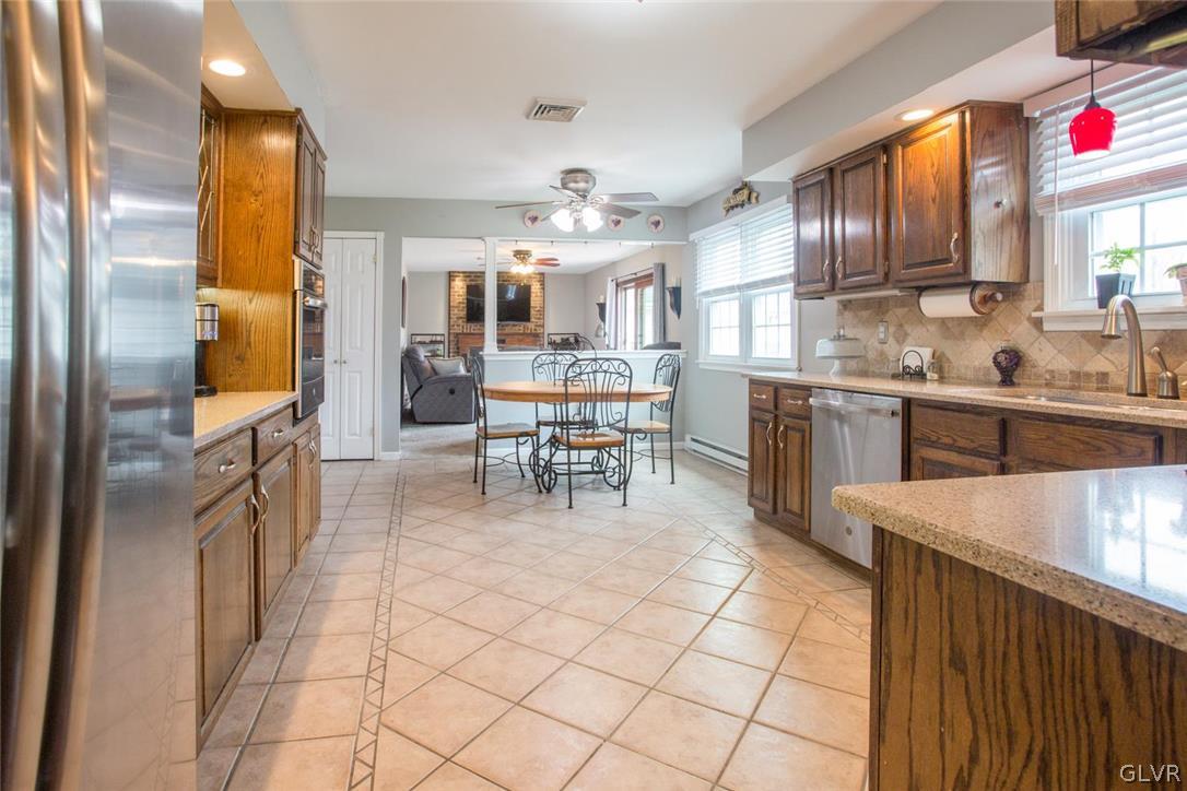 141 West Aluta Mill Road Nazareth, PA 18064 - Photo 7 of 32 a kitchen with stainless steel appliances granite countertop a sink and cabinets