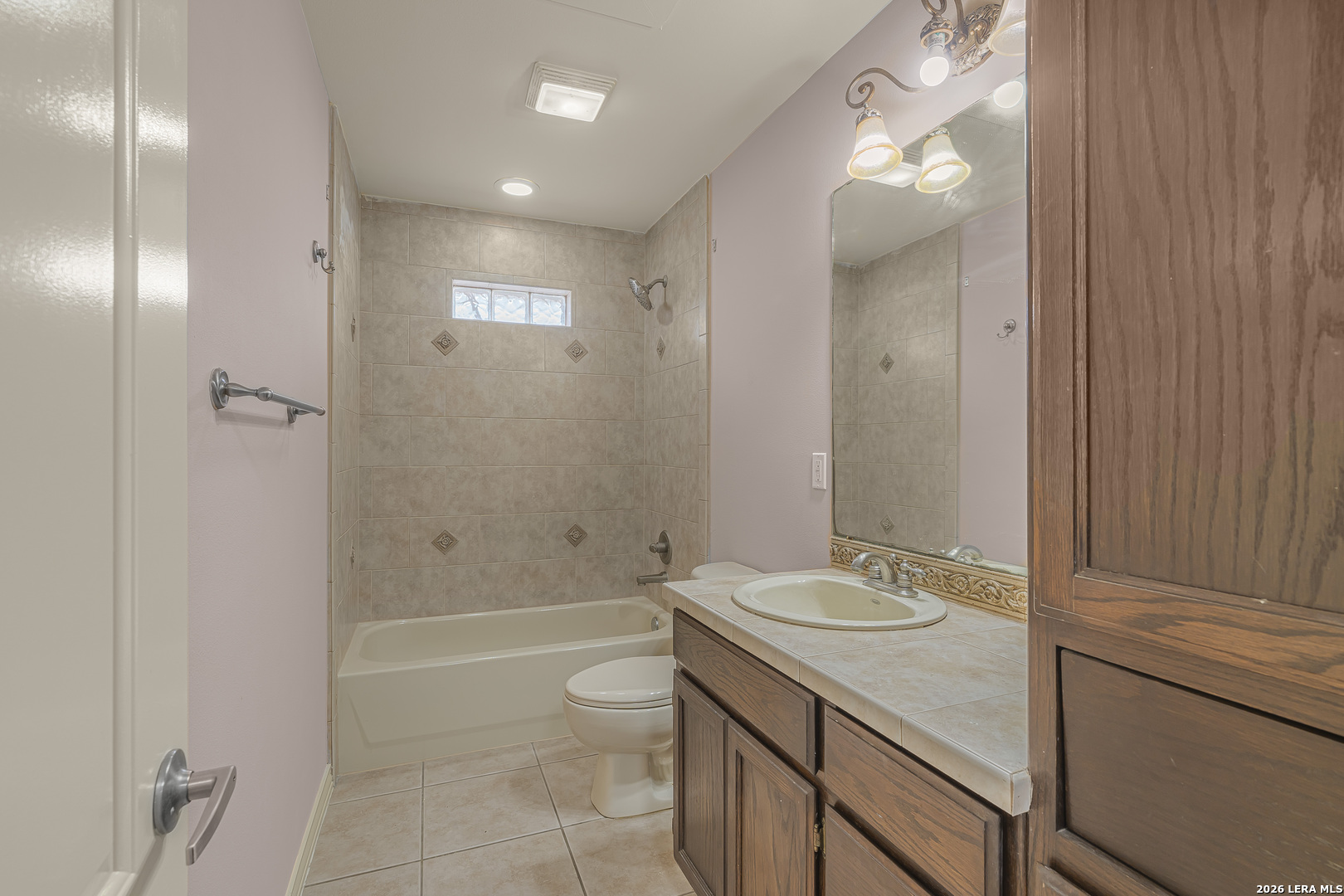 8710 Allegheny Laredo, TX 78045 - Photo 6 of 23 a bathroom with a granite countertop sink a toilet and shower