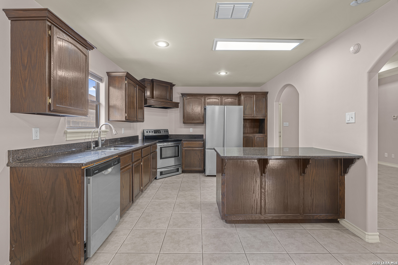 8710 Allegheny Laredo, TX 78045 - Photo 9 of 23 a kitchen with stainless steel appliances granite countertop a refrigerator and a stove