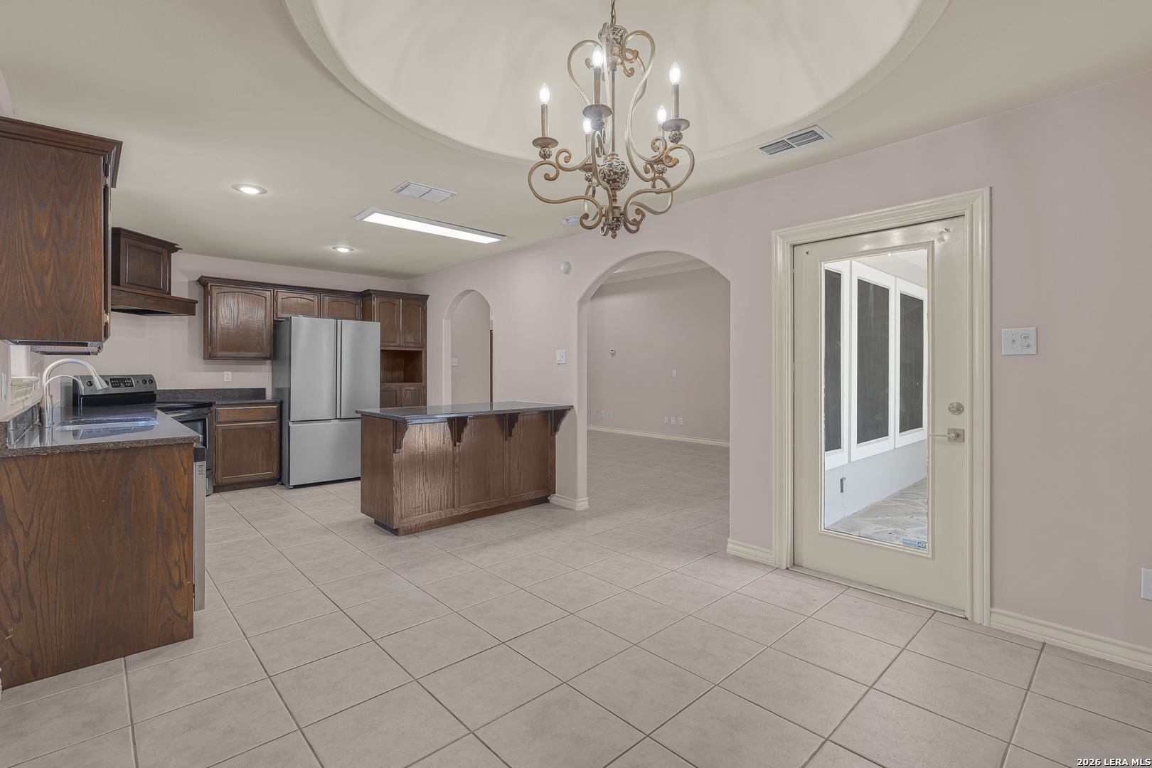 8710 Allegheny Laredo, TX 78045 - Photo 10 of 23 a large kitchen with stainless steel appliances granite countertop a refrigerator and a stove top oven