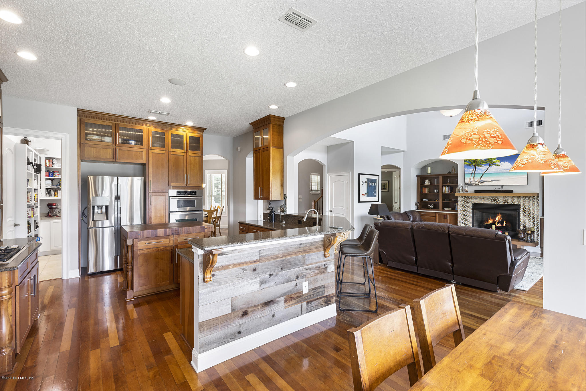 3255 Manatee Point Middleburg, FL 32068 - Photo 17 of 70 a living room with fireplace furniture and a wooden floor