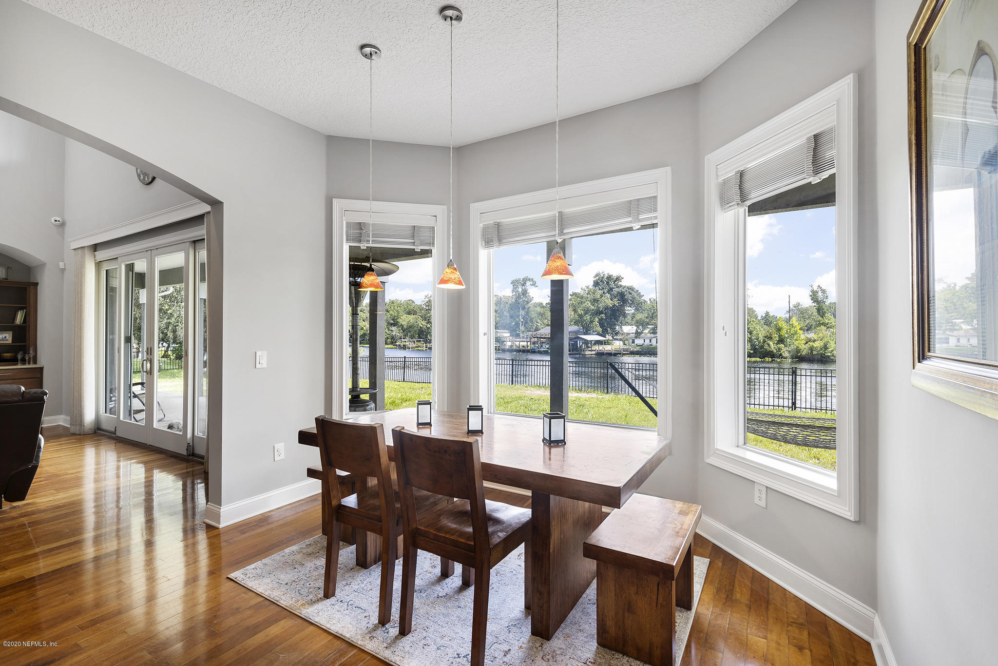 3255 Manatee Point Middleburg, FL 32068 - Photo 18 of 70 a view of a dining room with furniture window and wooden floor