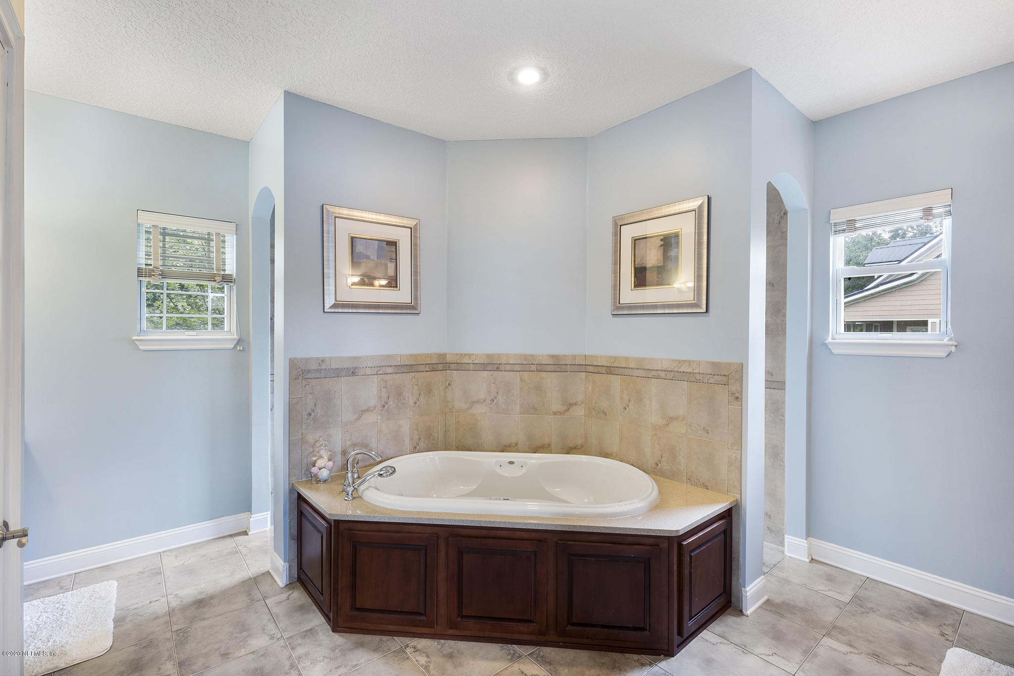 3255 Manatee Point Middleburg, FL 32068 - Photo 25 of 70 a bathroom with a sink and a mirror