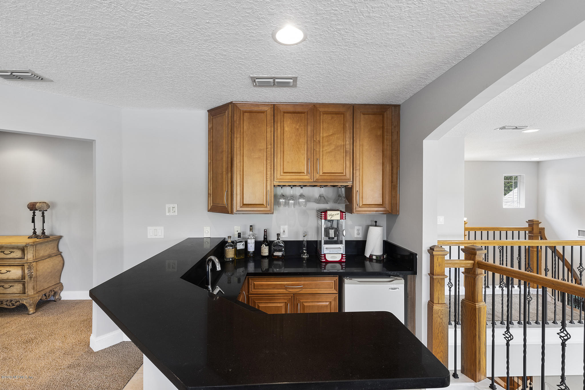 3255 Manatee Point Middleburg, FL 32068 - Photo 34 of 70 a kitchen with granite countertop a sink a stove and a wooden floor