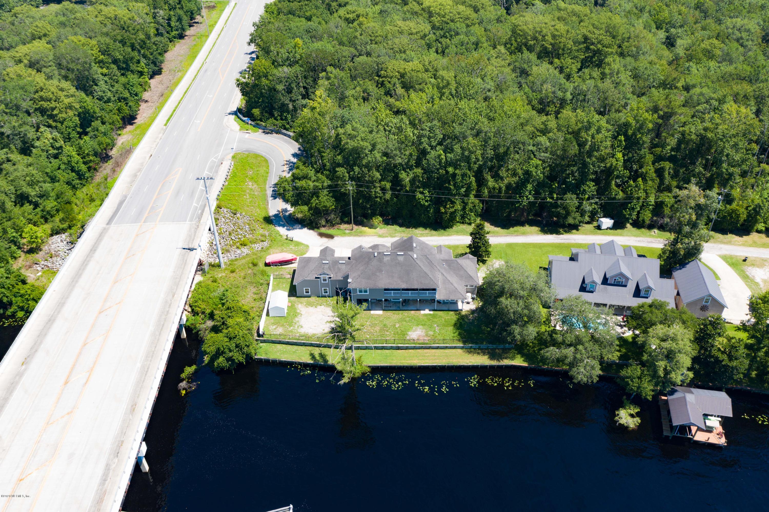 3255 Manatee Point Middleburg, FL 32068 - Photo 4 of 70 an aerial view of a house with a swimming pool patio and outdoor seating