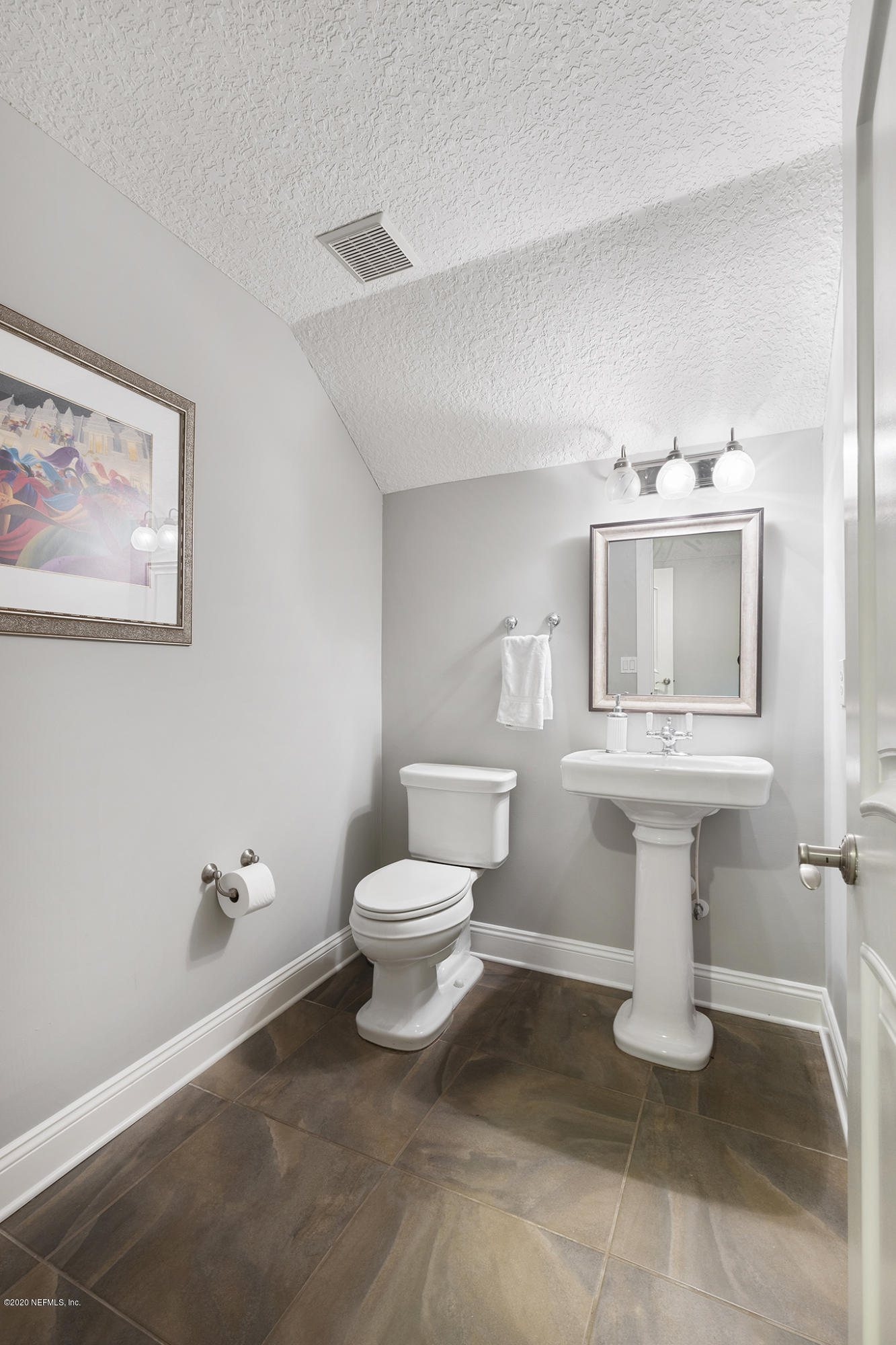 3255 Manatee Point Middleburg, FL 32068 - Photo 43 of 70 a bathroom with a sink toilet and a mirror