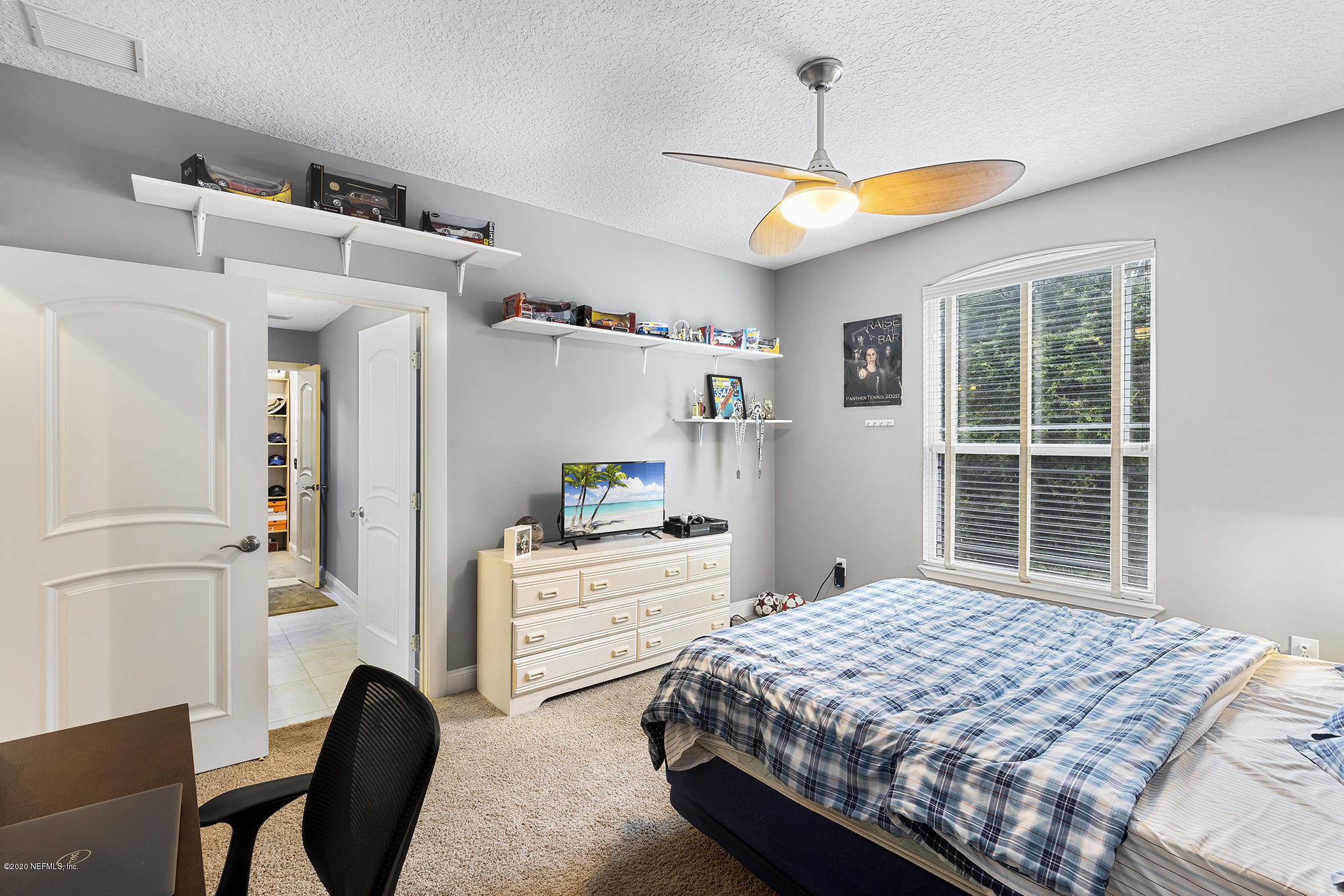 3255 Manatee Point Middleburg, FL 32068 - Photo 46 of 70 a bedroom with a bed dresser and a window