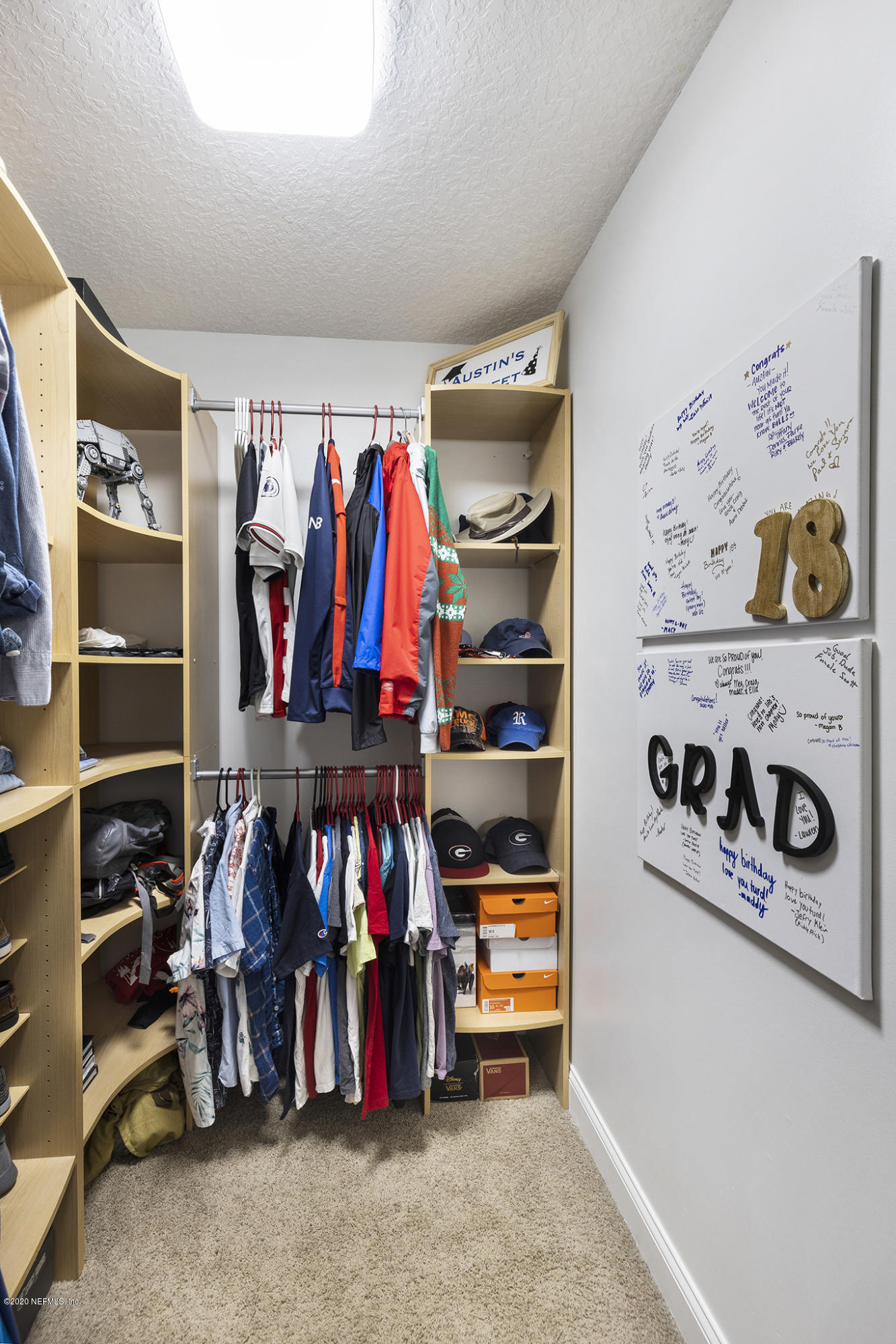 3255 Manatee Point Middleburg, FL 32068 - Photo 47 of 70 a view of walk in closet with clothes and shoes