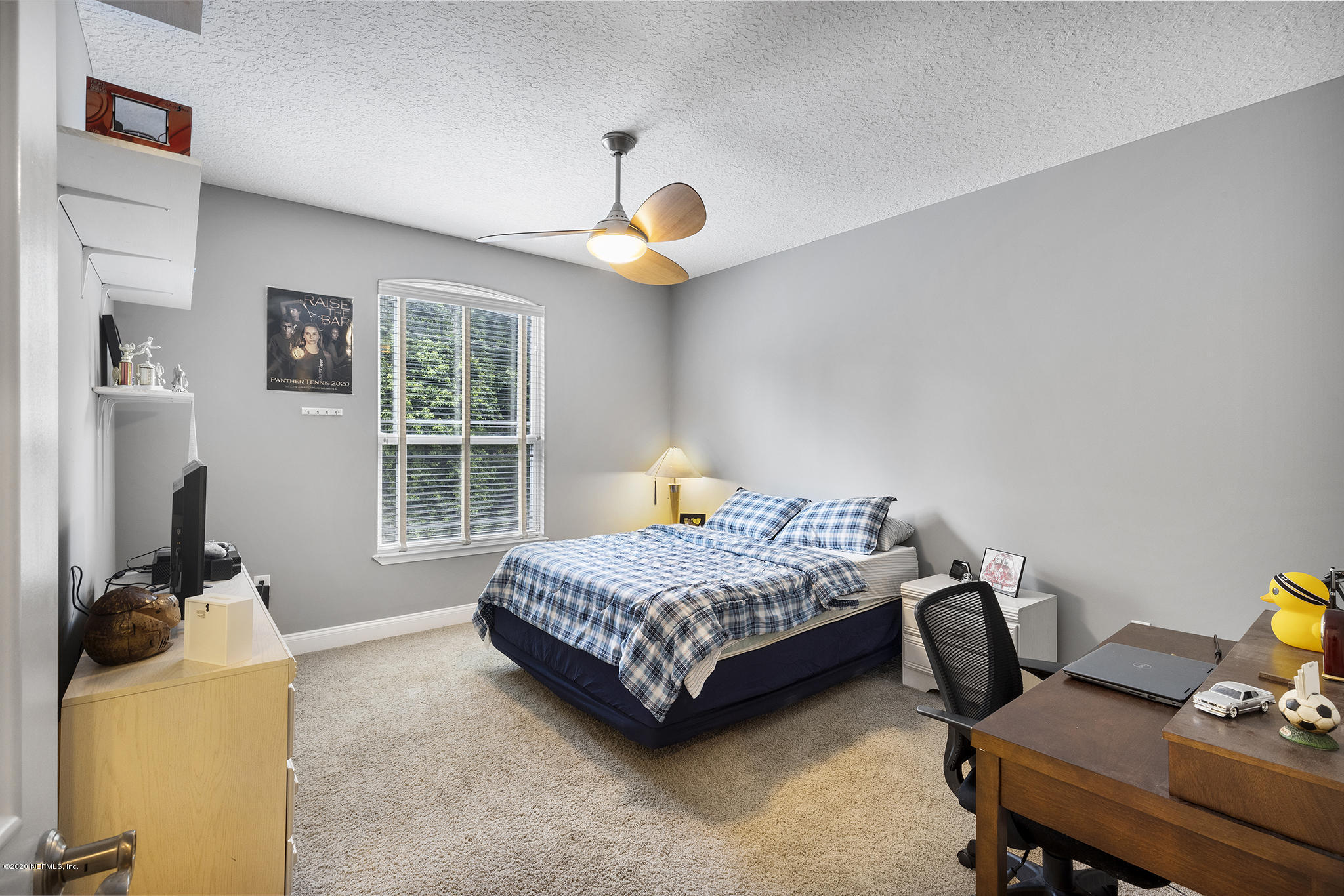 3255 Manatee Point Middleburg, FL 32068 - Photo 49 of 70 a bedroom with a workspace bed and a window