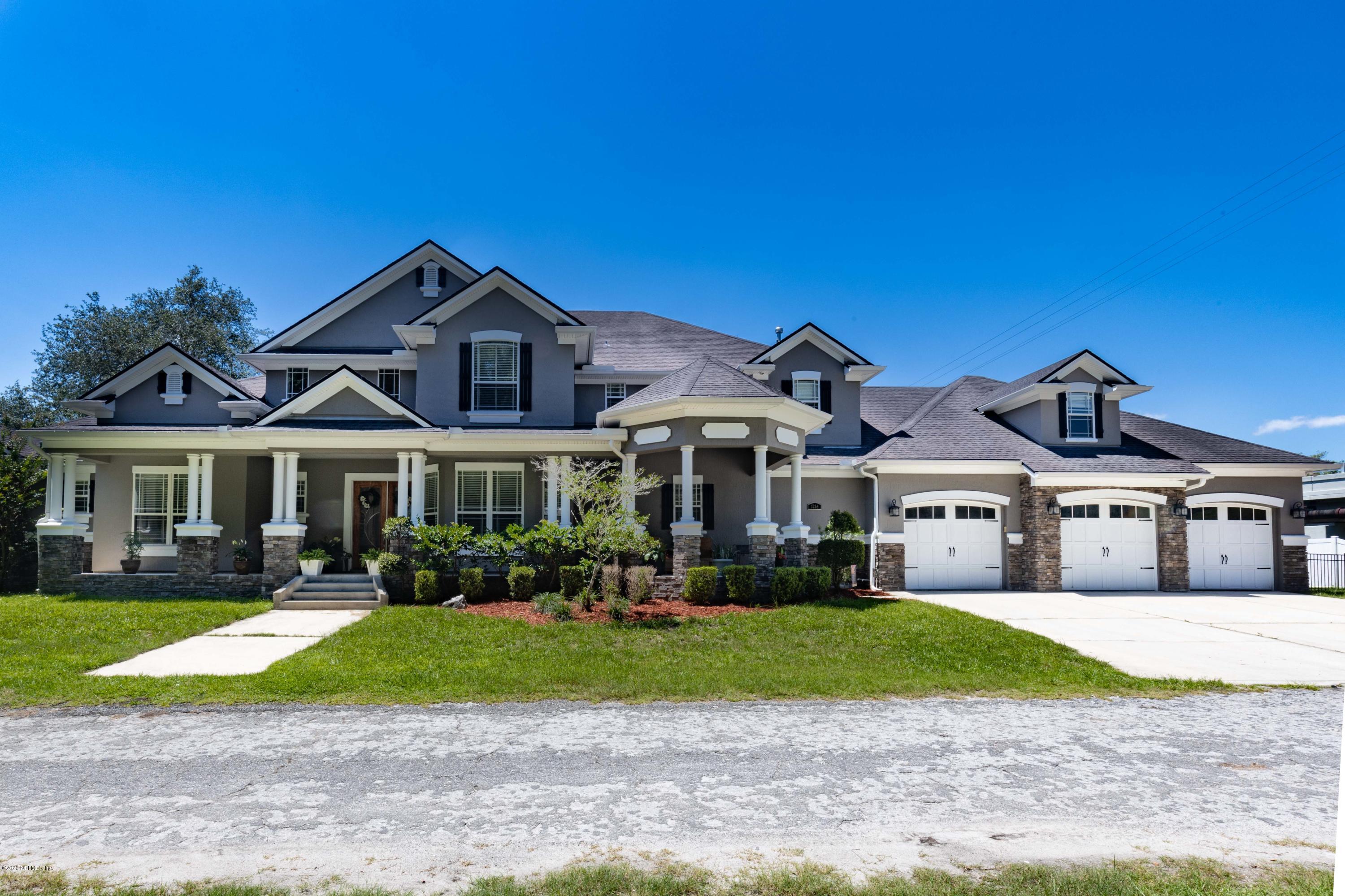 3255 Manatee Point Middleburg, FL 32068 - Photo 61 of 70 a front view of a house with a yard