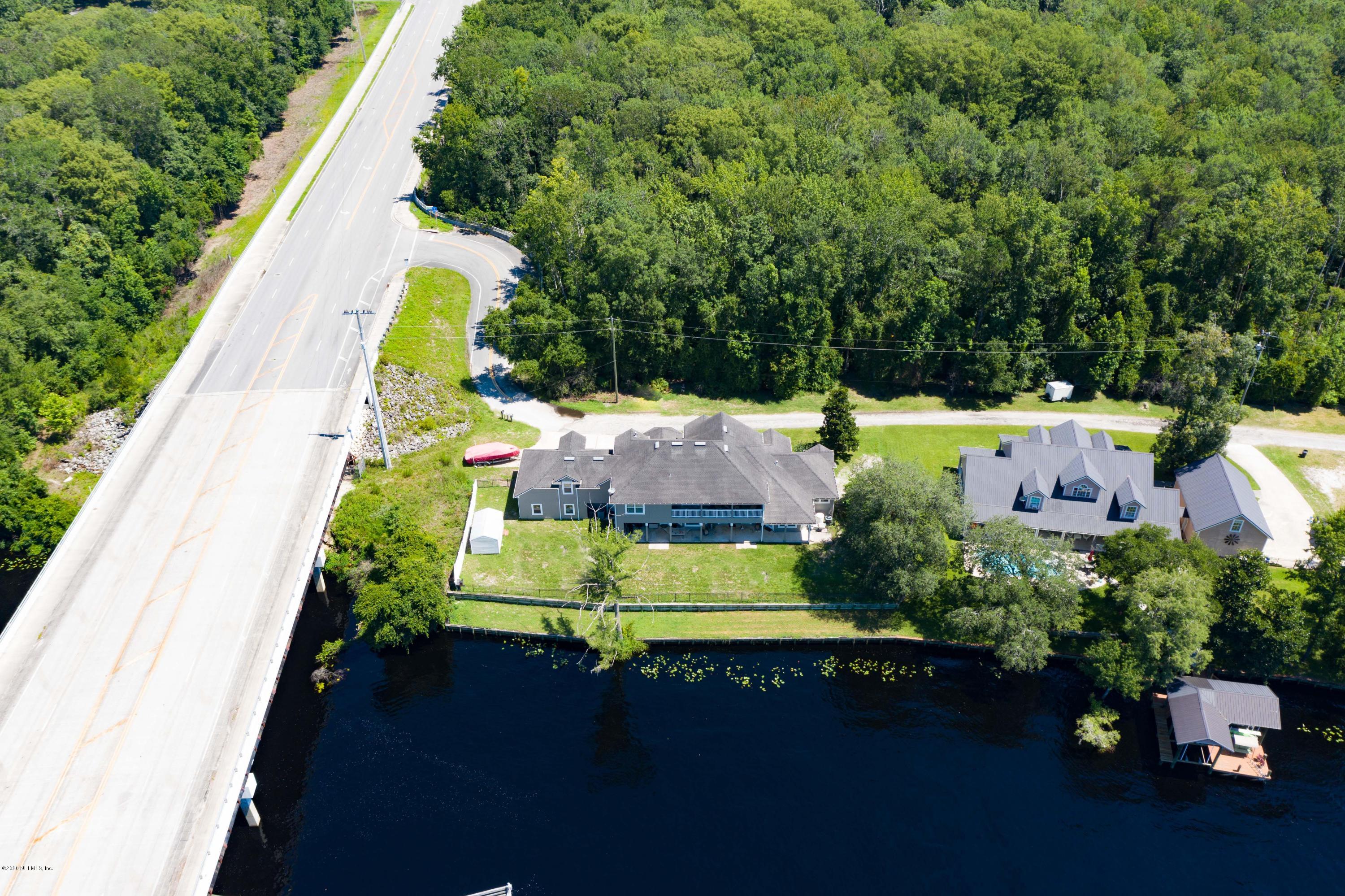 3255 Manatee Point Middleburg, FL 32068 - Photo 65 of 70 an aerial view of a house with a swimming pool