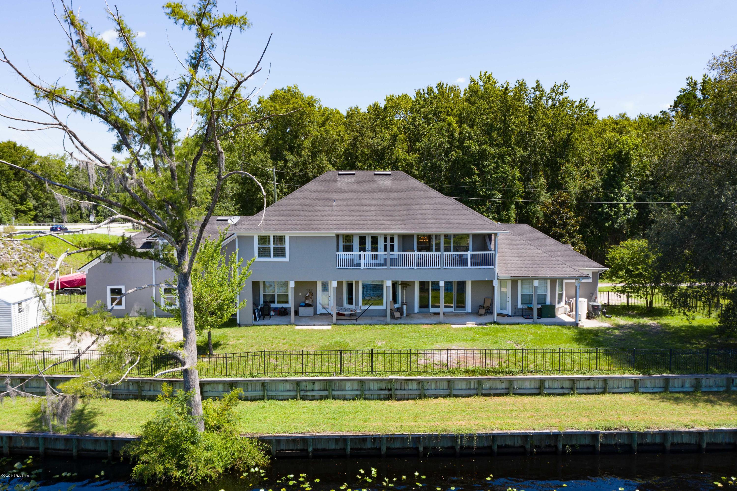 3255 Manatee Point Middleburg, FL 32068 - Photo 66 of 70 a view of a house with a swimming pool