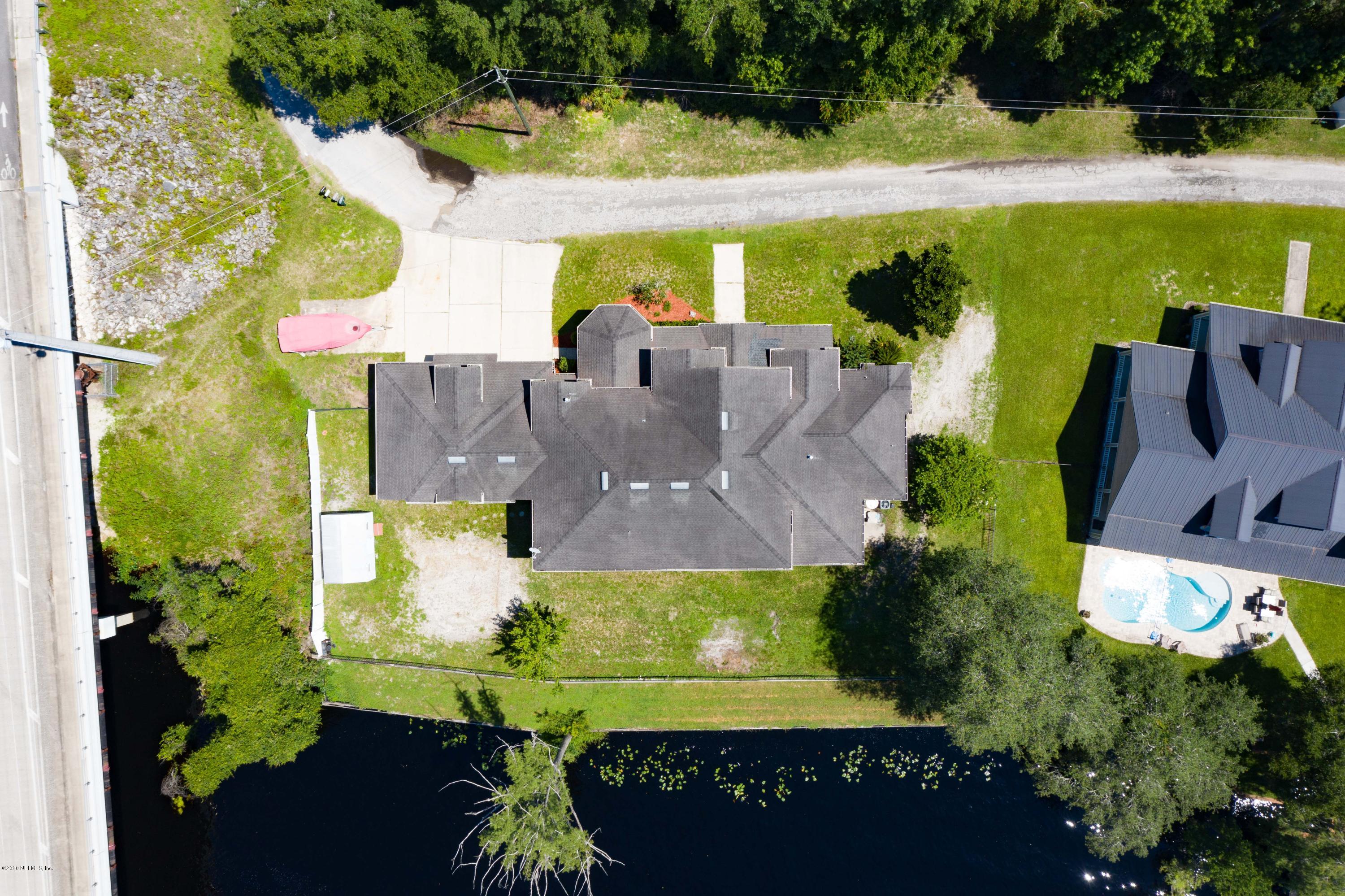3255 Manatee Point Middleburg, FL 32068 - Photo 68 of 70 an aerial view of house with yard swimming pool and outdoor seating