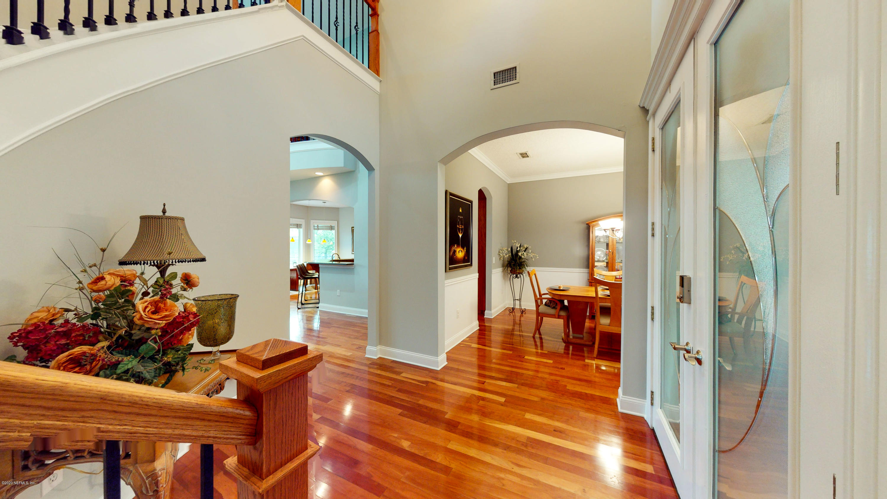 3255 Manatee Point Middleburg, FL 32068 - Photo 9 of 70 a living room with dining room and wooden floor