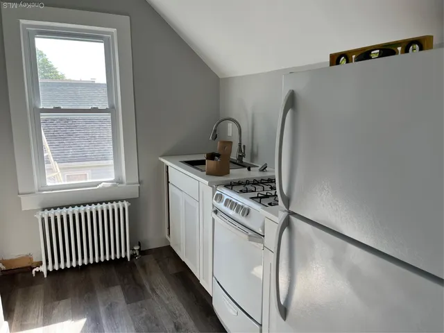 a kitchen with a stove and a microwave
