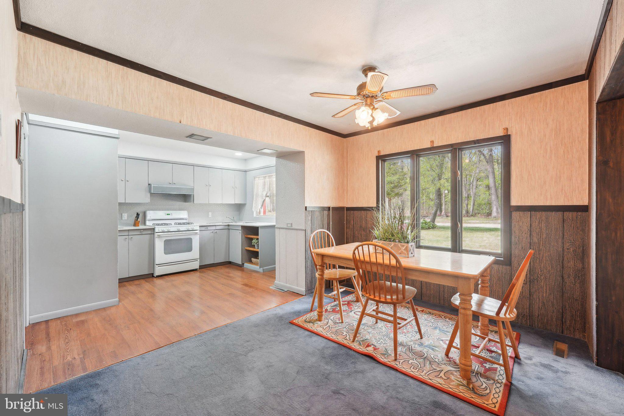 2 Oakview Drive Berlin, NJ 08009 - Photo 12 of 64 a view of a dining room with furniture window and wooden floor