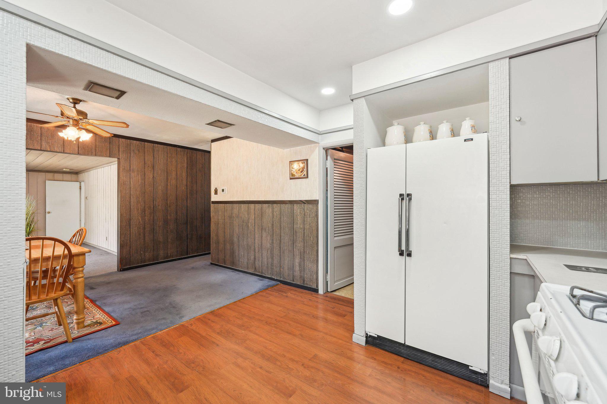 2 Oakview Drive Berlin, NJ 08009 - Photo 18 of 64 a view of a hallway to a room with wooden floor and windows
